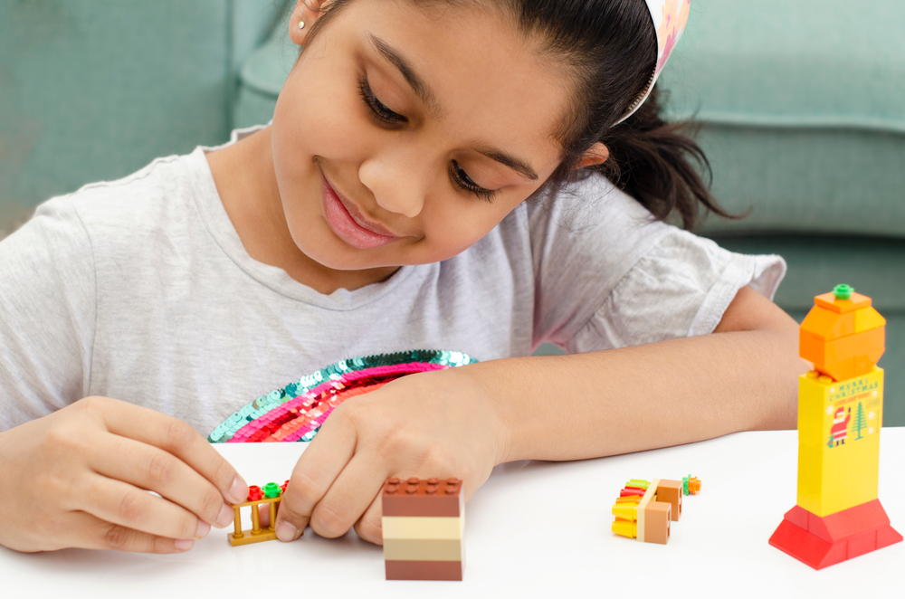 A,Cute,Little,Indian,Girl,Playing,With,Colourful,Toy,Building